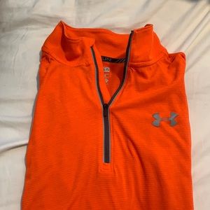 Neon orange running under armer jacket
